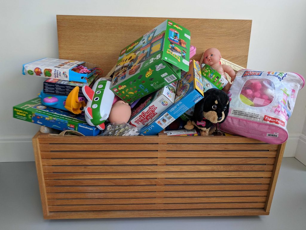 Toy box overflowing with kids toys