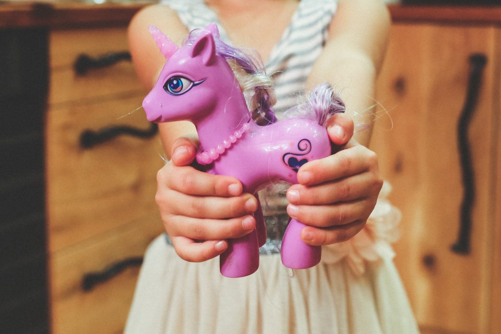 Girl sharing toys